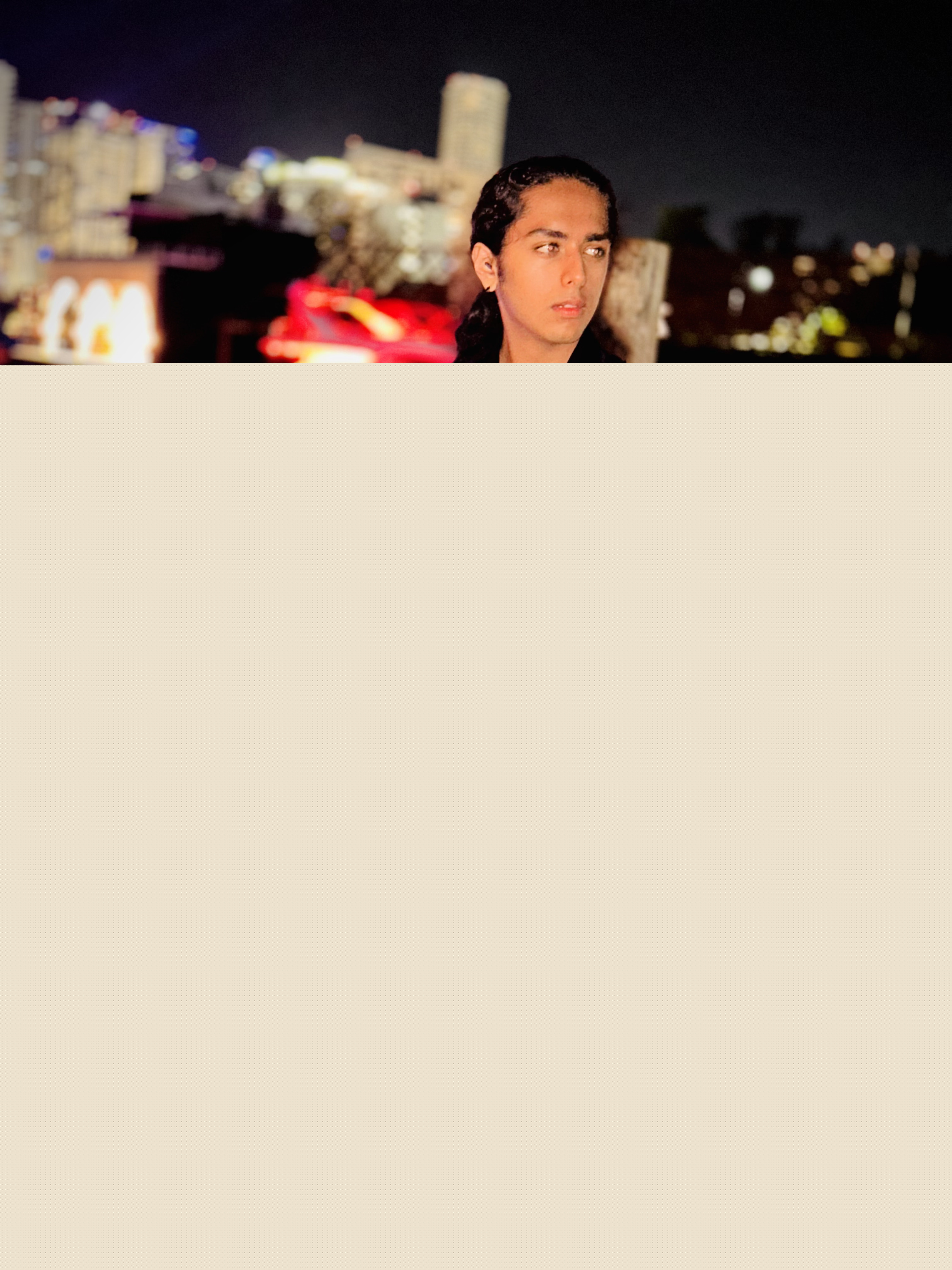 Aryan Rohira at the Miami River waterfront with city reflections